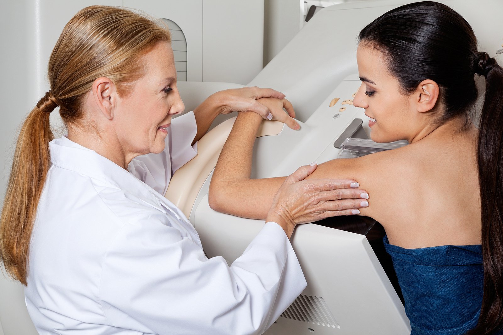 bigstock-Mature-female-doctor-assisting-40623874